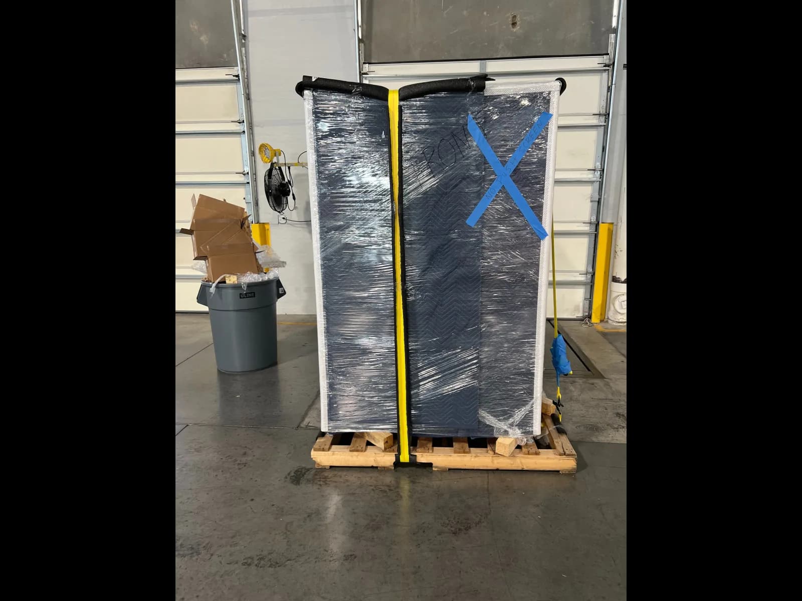 Wrapped vending machine secured for relocation